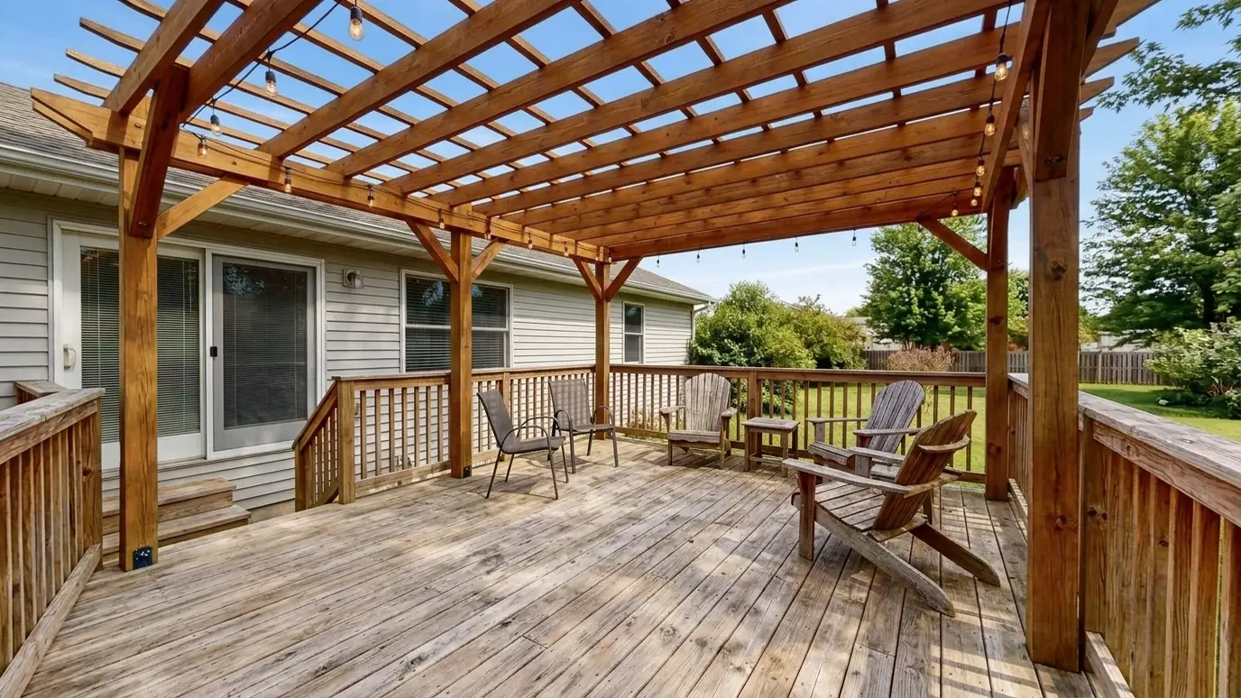After: Plain deck gets a pergola and lights | Music City Pergola After: a backyard deck with a stained cedar pergola with string lights over the deck