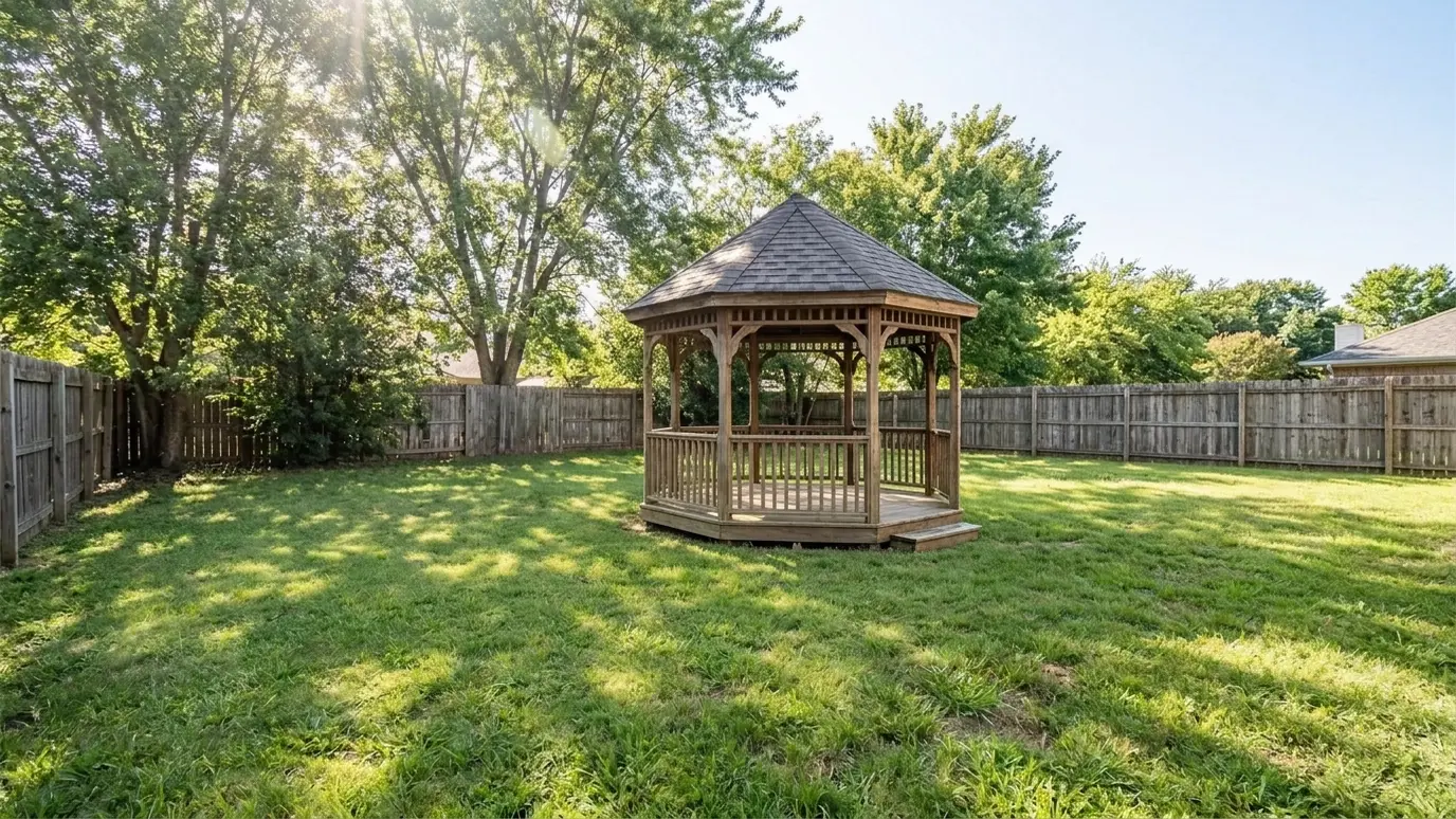 After: Open lawn gets a gazebo | Music City Pergola After: a backyard lawn with a wooden octagonal gazebo with a shingled roof